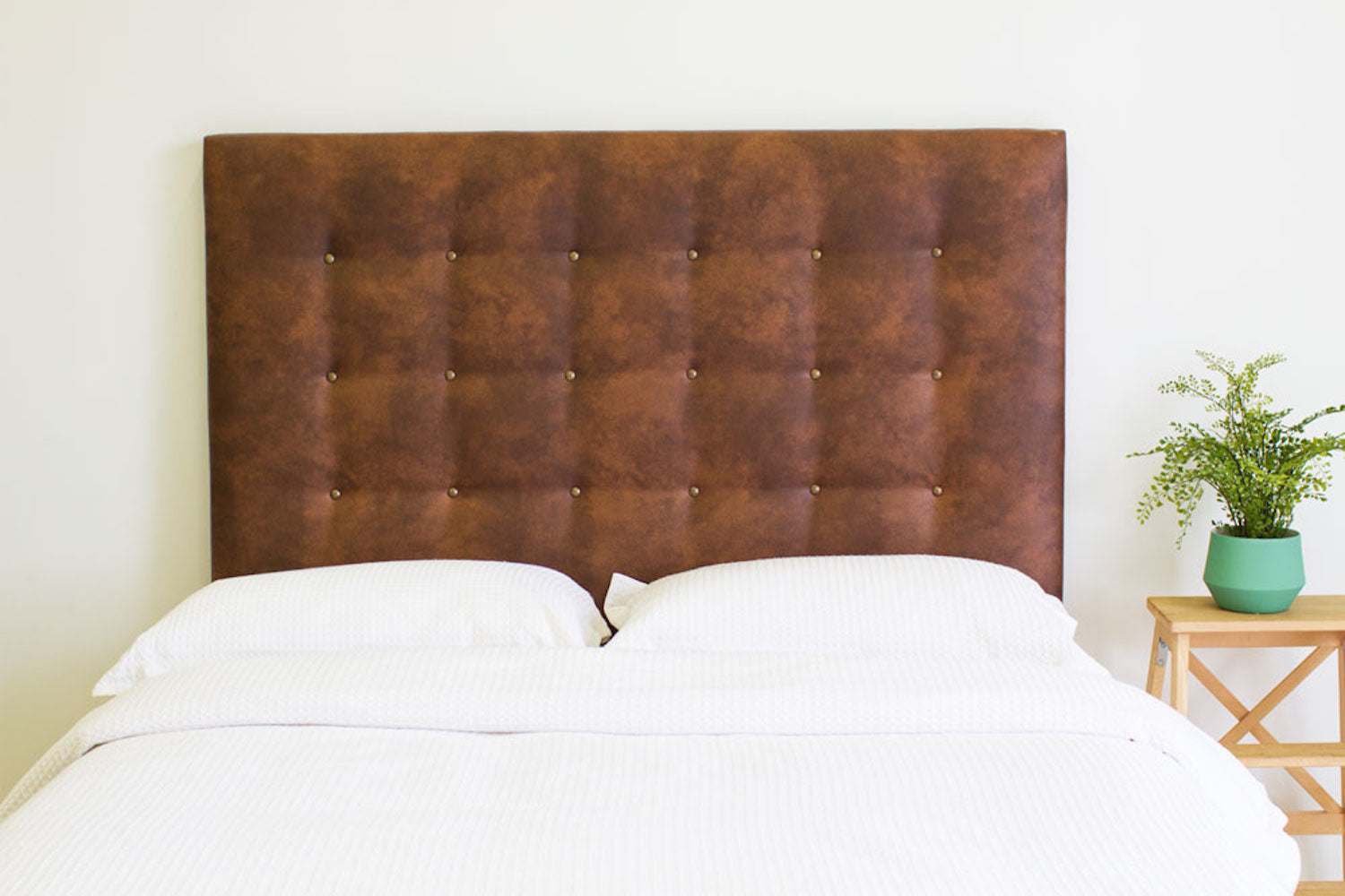 Brown tufted headboard on a bed, Australian furniture brand