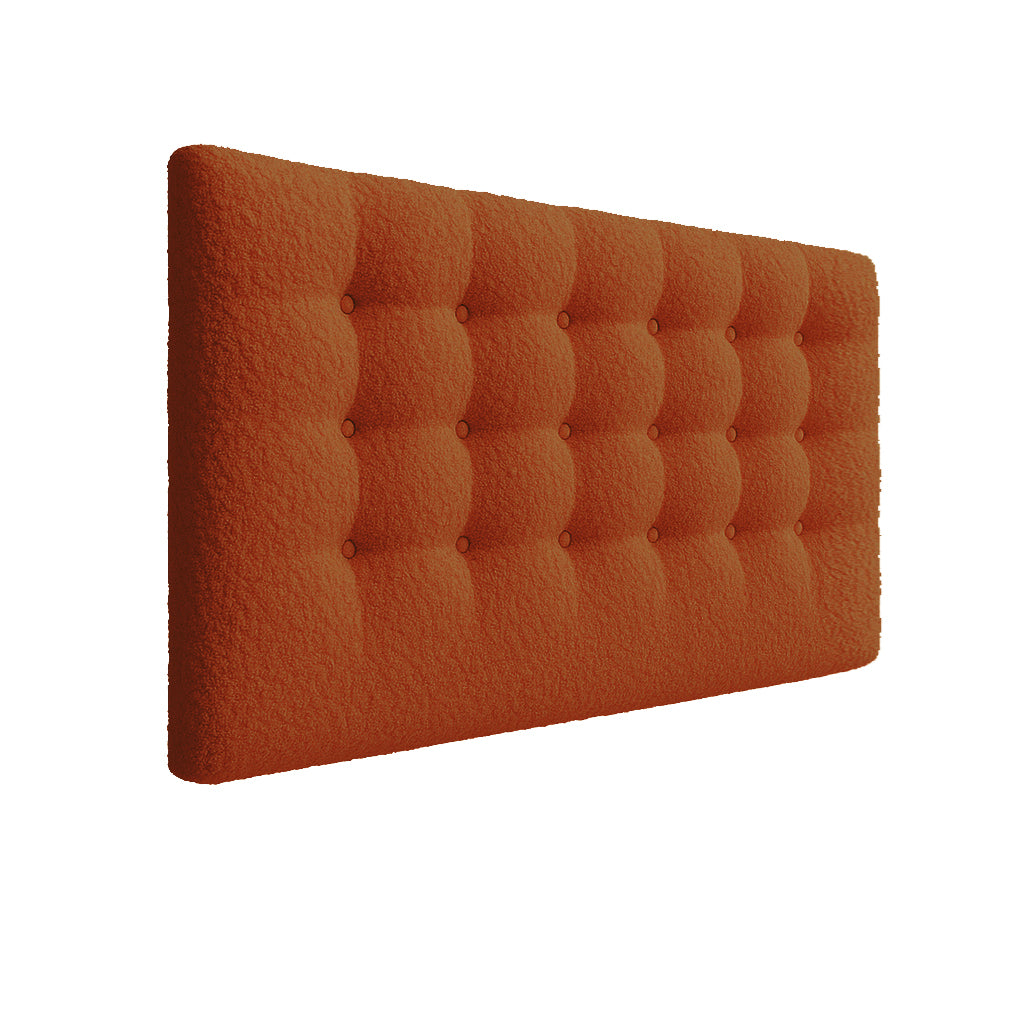 Umber tufted headboard on a white background